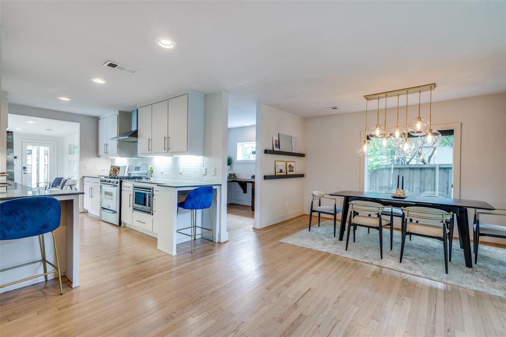9803 Lakemont Drive Dallas, TX 75220 - Photo 6 of 13 a living room kitchen with furniture wooden floor and a kitchen view