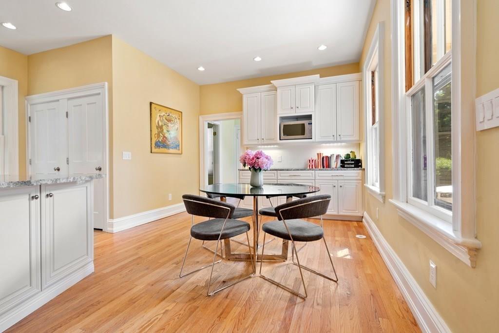 699 Boston Post Road Weston, MA 02493 - Photo 16 of 41 a dining room with furniture and wooden floor