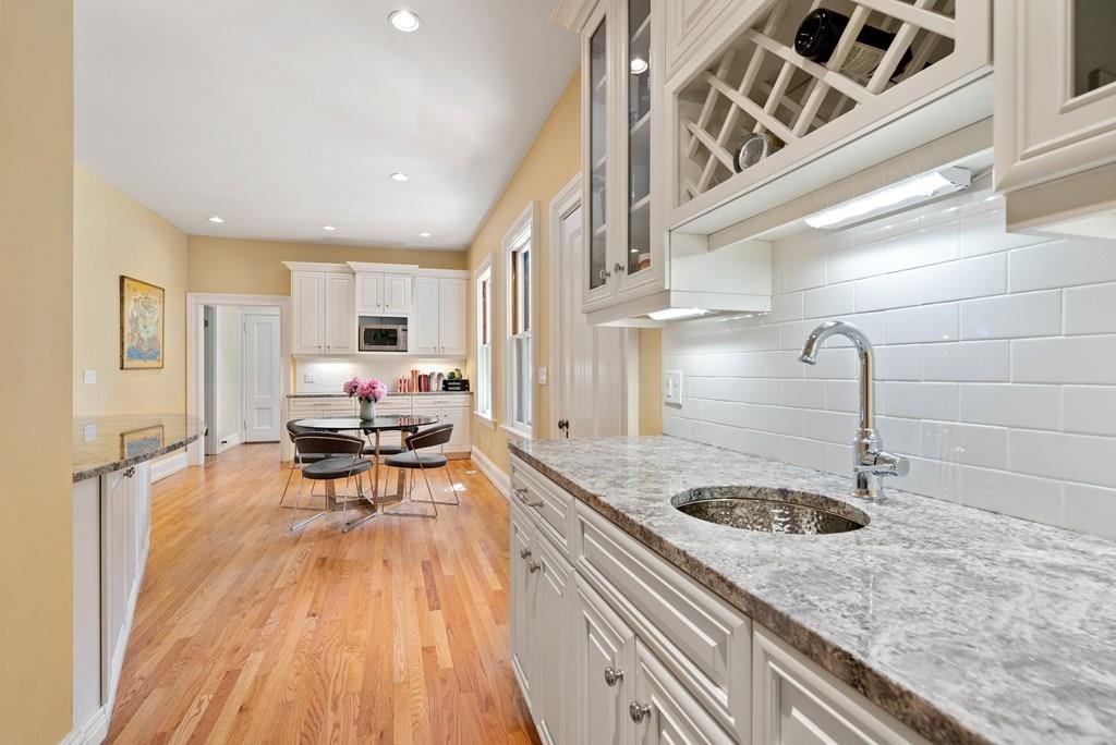 699 Boston Post Road Weston, MA 02493 - Photo 18 of 41 a kitchen with a sink appliances and cabinets