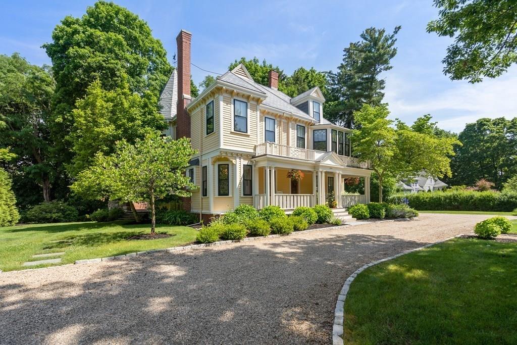 699 Boston Post Road Weston, MA 02493 - Photo 2 of 41 a front view of a house with garden