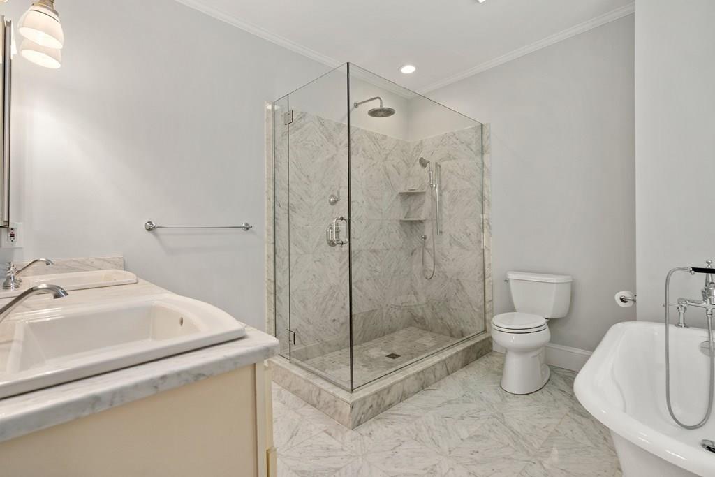 699 Boston Post Road Weston, MA 02493 - Photo 25 of 41 a bathroom with a shower a toilet and sink