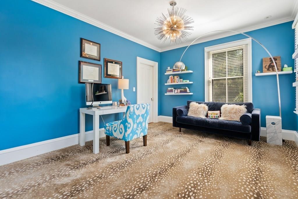 699 Boston Post Road Weston, MA 02493 - Photo 28 of 41 a bedroom with furniture and a wooden floor