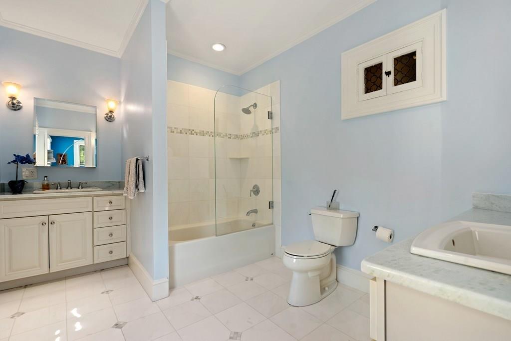 699 Boston Post Road Weston, MA 02493 - Photo 31 of 41 a bathroom with a toilet sink and a mirror