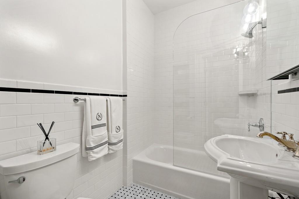 699 Boston Post Road Weston, MA 02493 - Photo 32 of 41 a bathroom with a sink a toilet and a bathtub