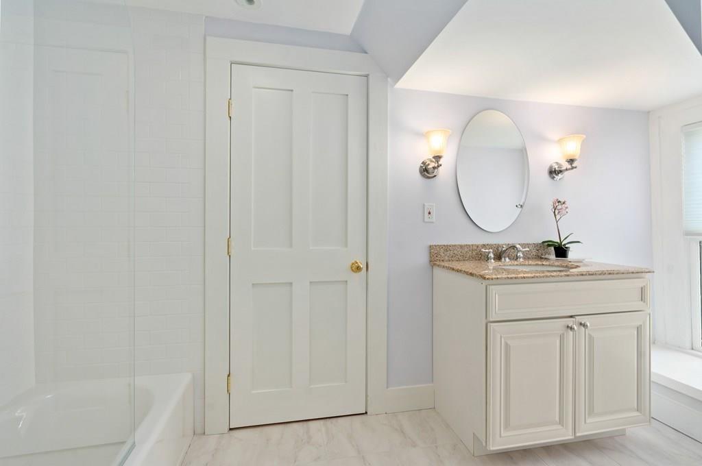699 Boston Post Road Weston, MA 02493 - Photo 33 of 41 a bathroom with a sink and a mirror
