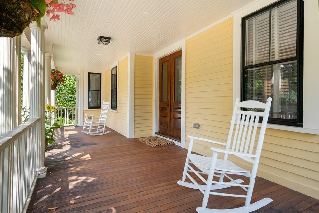 699 Boston Post Road Weston, MA 02493 - Photo 37 of 41 a view of a balcony with chair and wooden floor