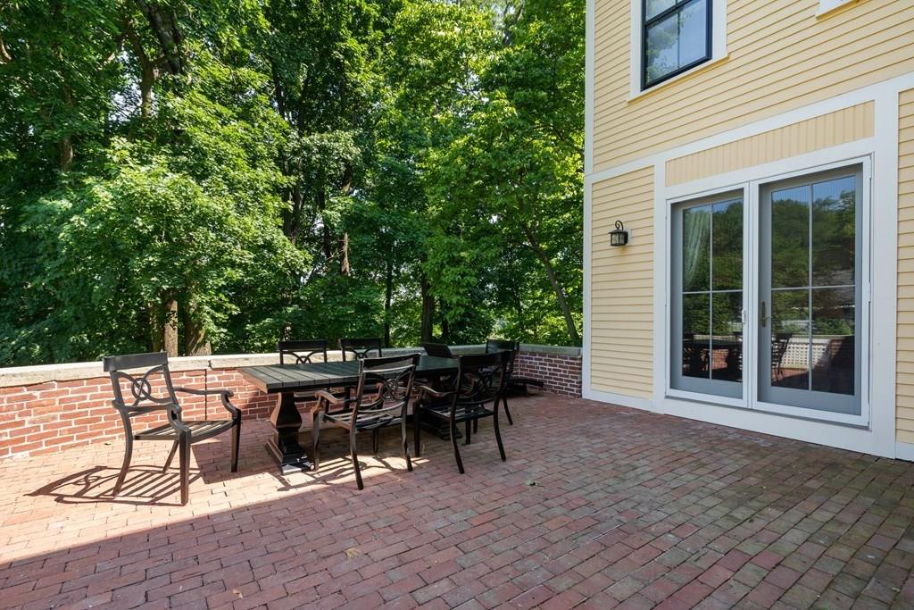 699 Boston Post Road Weston, MA 02493 - Photo 39 of 41 a view of a dinning table and chairs in the patio