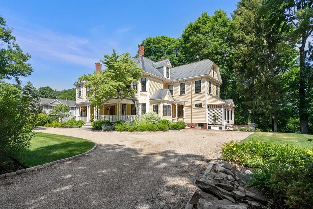 699 Boston Post Road Weston, MA 02493 - Photo 41 of 41 a view of a white house with a big yard and large trees