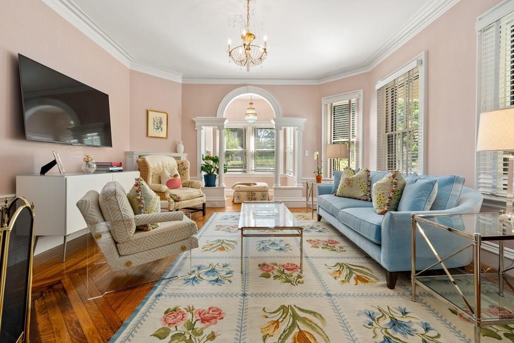 699 Boston Post Road Weston, MA 02493 - Photo 6 of 41 a living room with furniture a flat screen tv and a fireplace