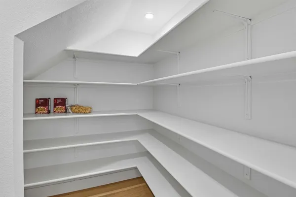 a view of an empty walk in closet
