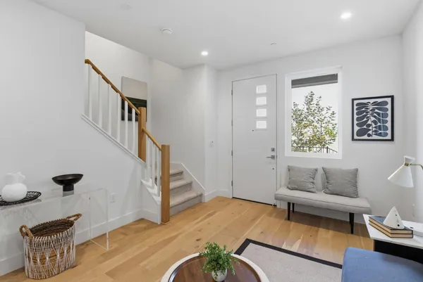 a living room with furniture and a rug