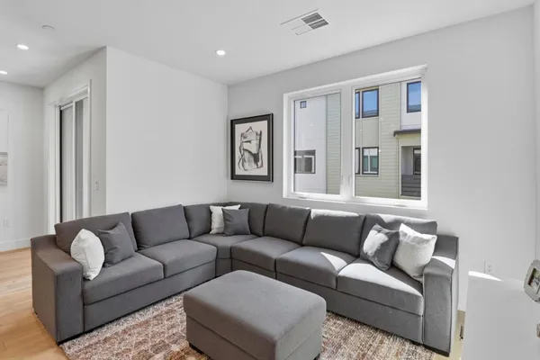 a living room with furniture and windows