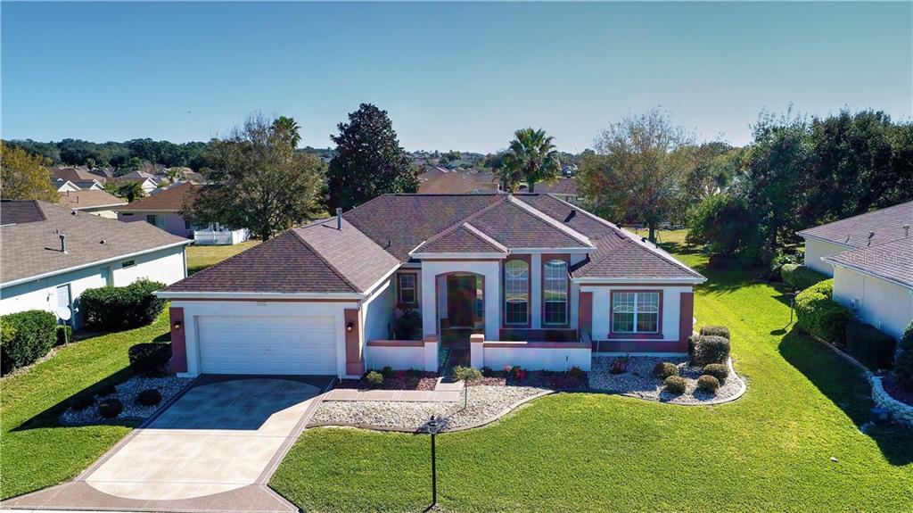 12531 Southeast 93rd Court Road Summerfield, FL 34491 - Photo 1 of 1 a aerial view of a house with swimming pool and a yard