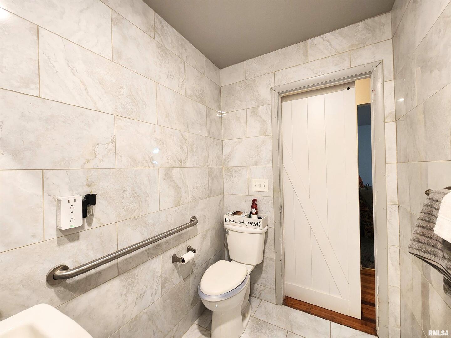 355 Chestnut Street Alto Pass, IL 62905 - Photo 13 of 26 a white toilet sitting next to a bathroom sink