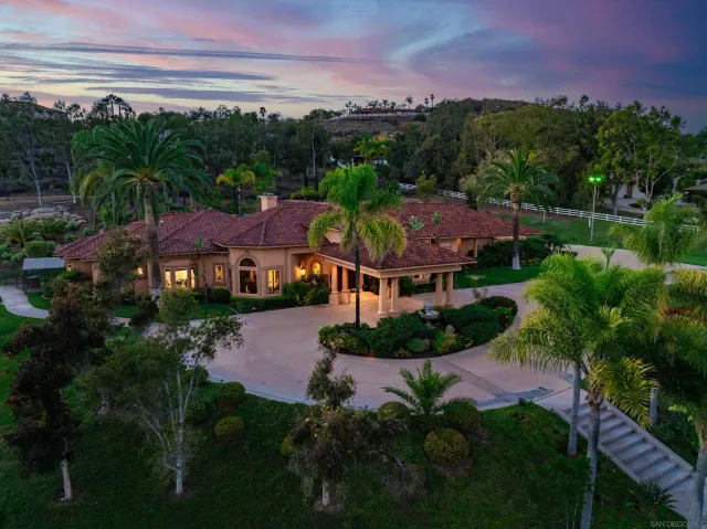 a view of a house with swimming pool yard and patio