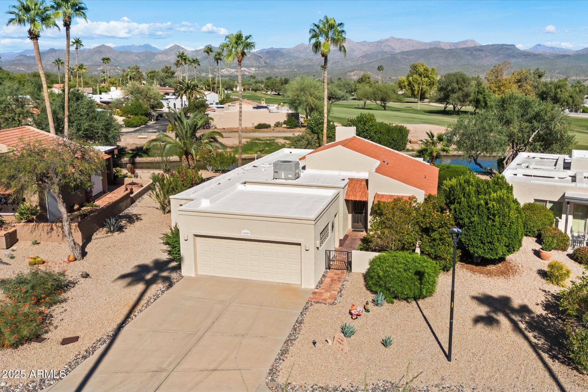 a aerial view of a house with a garden