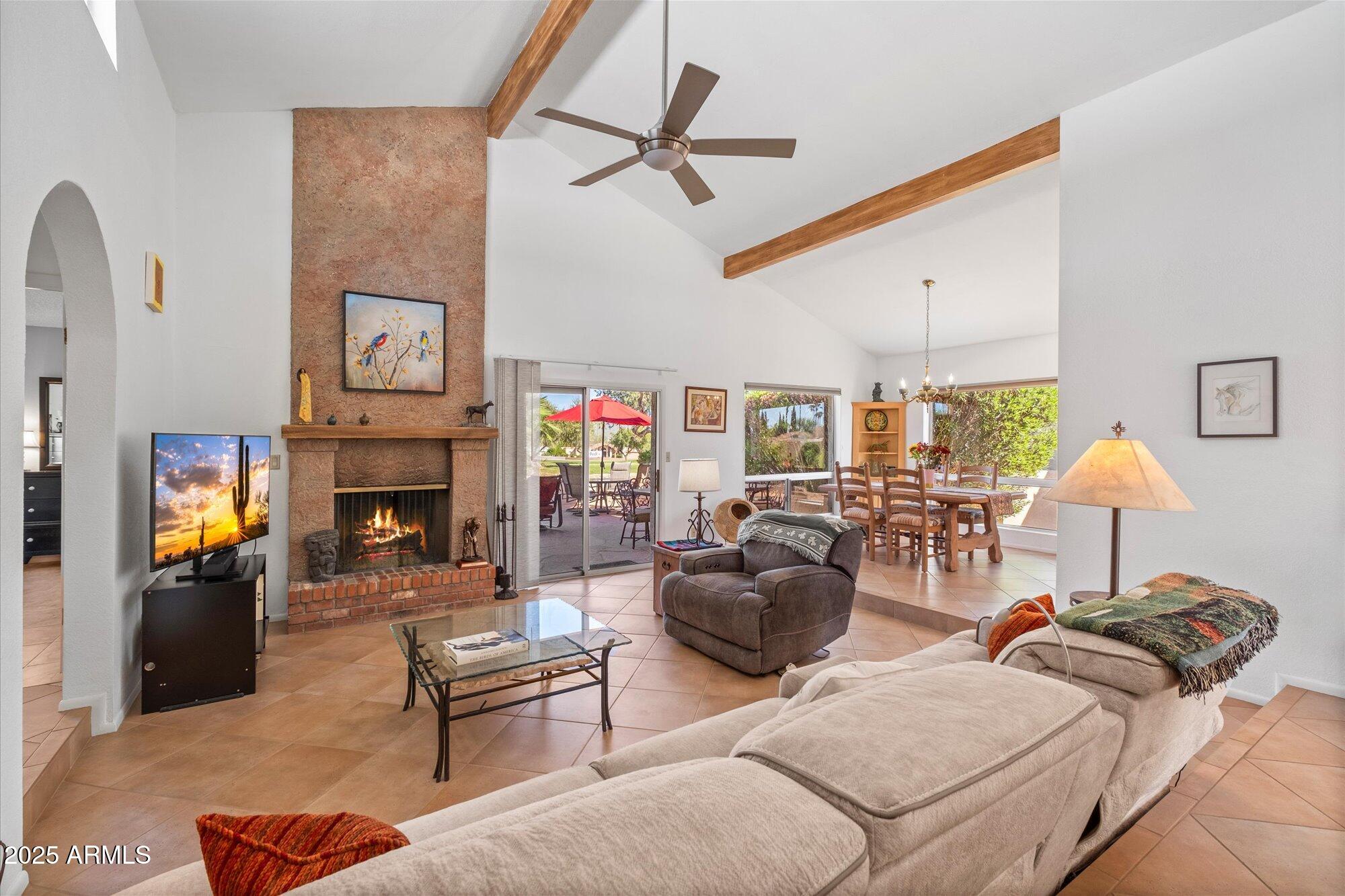 18720 East Vía Laguna Rio Verde, AZ 85263 - Photo 11 of 37 a living room with furniture and a fireplace