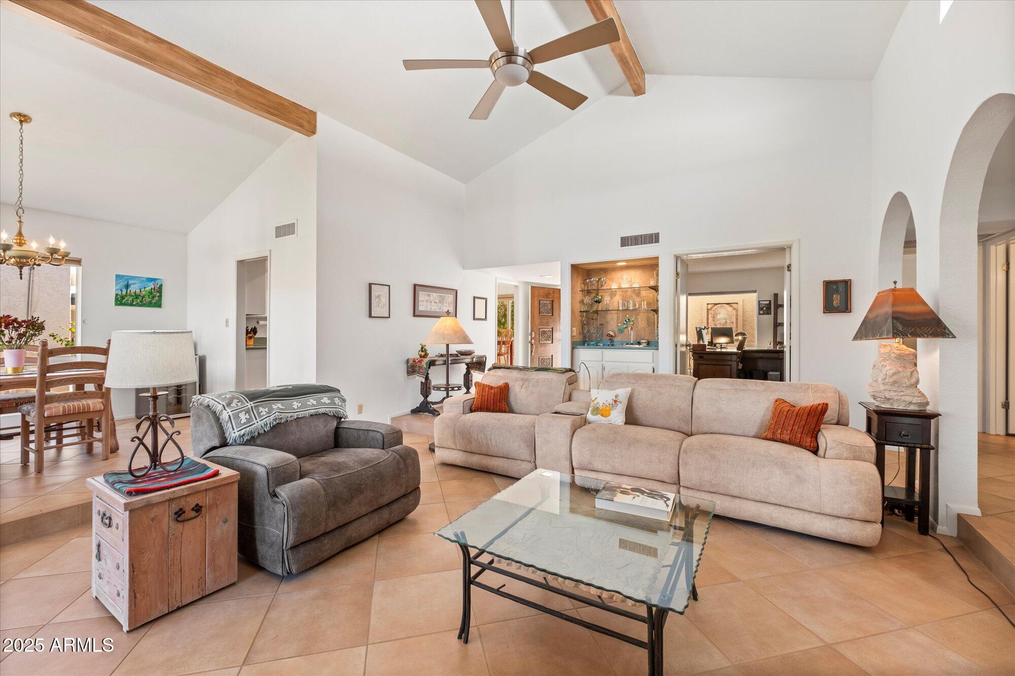 18720 East Vía Laguna Rio Verde, AZ 85263 - Photo 12 of 37 a living room with furniture and a large window