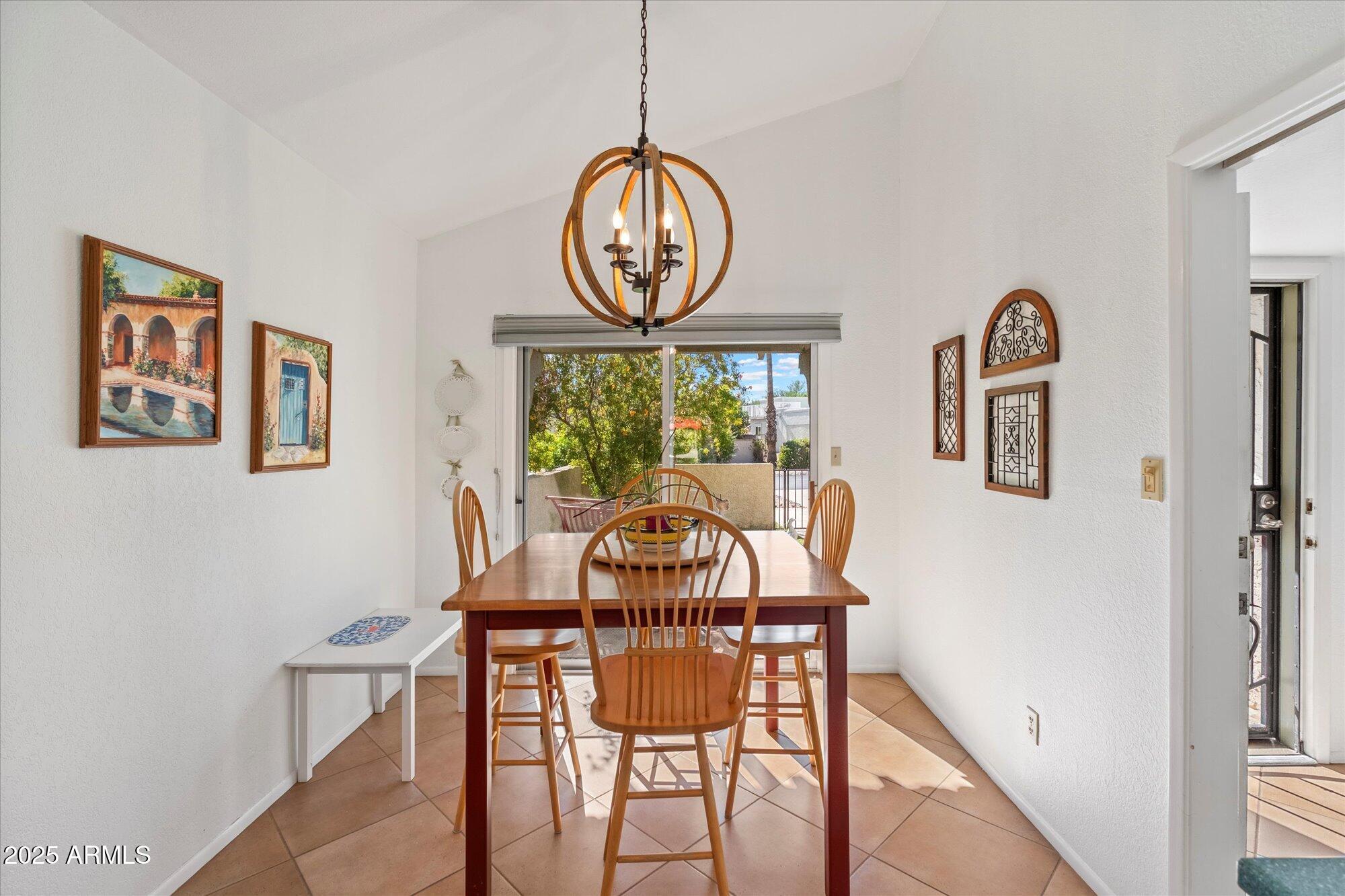 18720 East Vía Laguna Rio Verde, AZ 85263 - Photo 13 of 37 a view of a dining room with furniture window and wooden floor