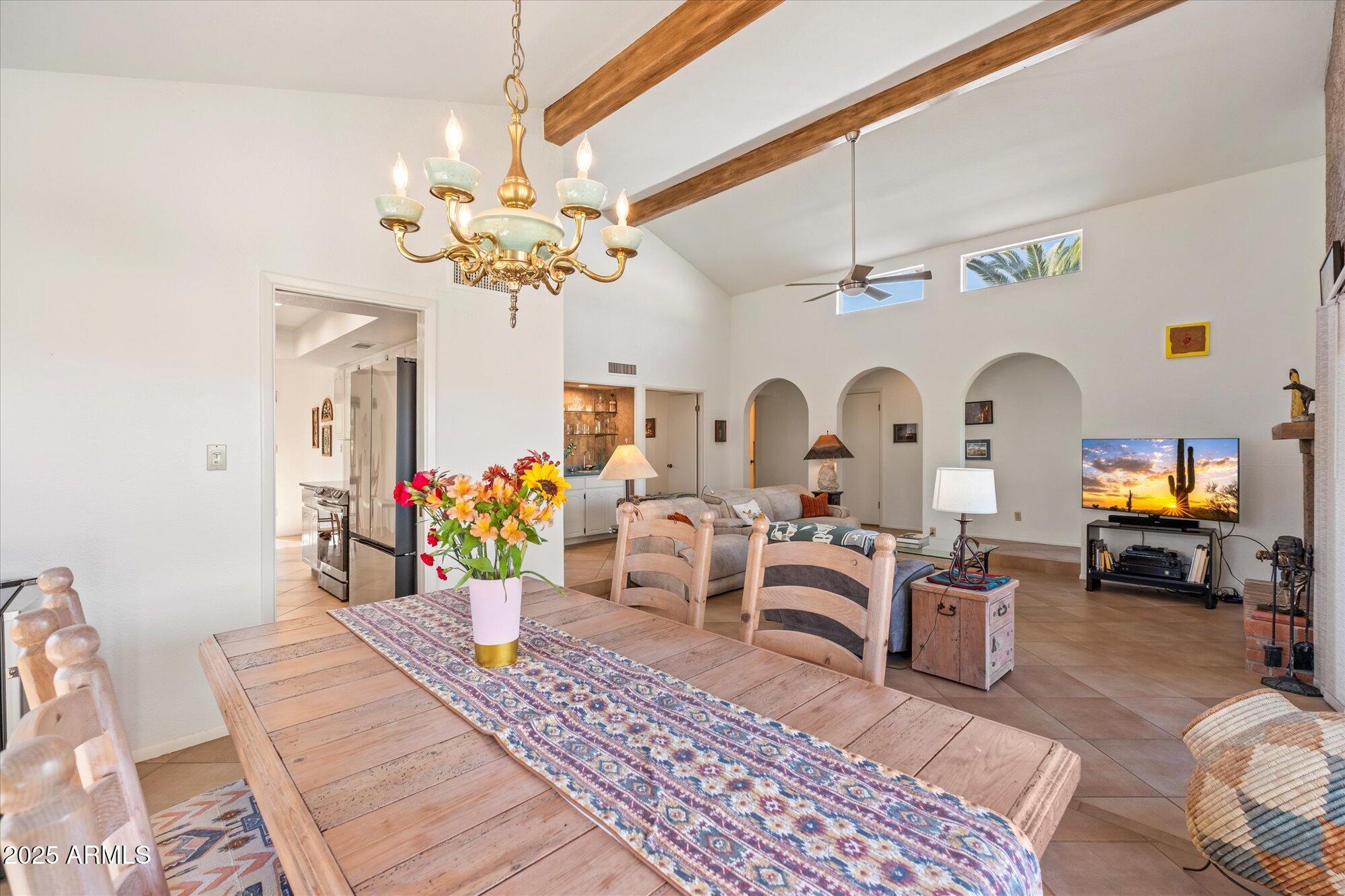 18720 East Vía Laguna Rio Verde, AZ 85263 - Photo 9 of 37 a living room with furniture chandelier and a fireplace