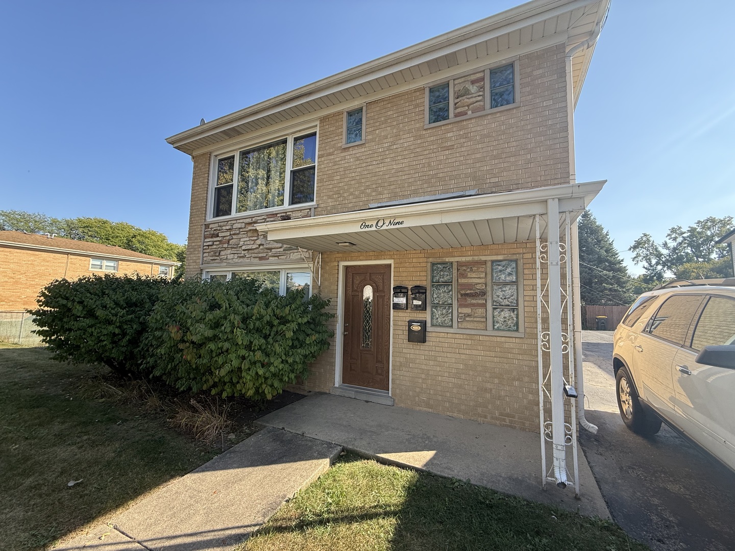 a front view of a house with garden