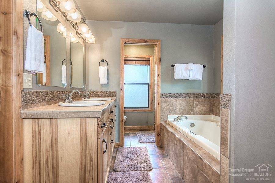 18138 Modoc Lane Sunriver, OR 97707 - Photo 13 of 25 Tile flooring and counter tops with a hi