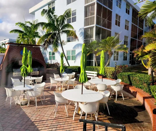 a view of a chairs and table in a patio