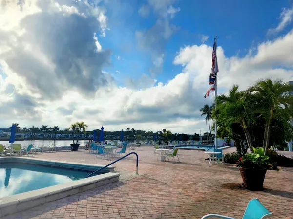 a view of swimming pool with seating space