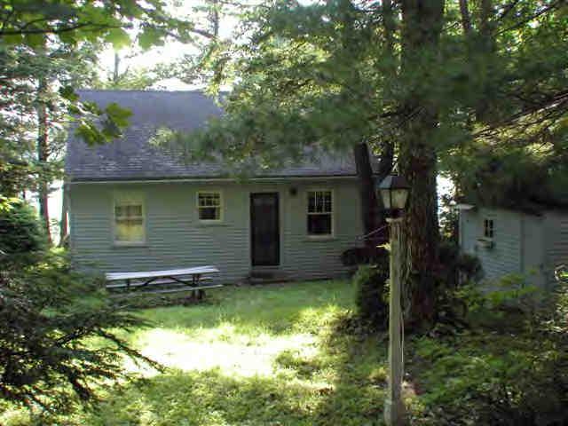 16 Pine Ext Road East Otis, MA 01029 - Photo 3 of 6 a backyard of a house with yard and outdoor seating