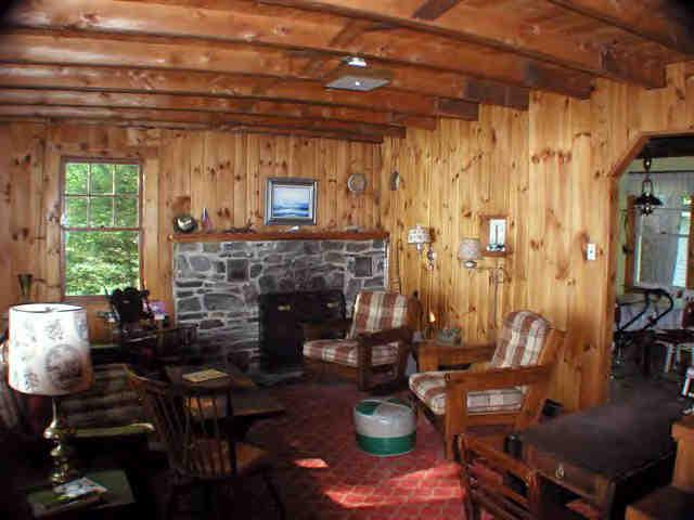16 Pine Ext Road East Otis, MA 01029 - Photo 4 of 6 a living room with furniture and a fireplace