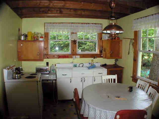 16 Pine Ext Road East Otis, MA 01029 - Photo 5 of 6 a kitchen with a table chairs and a chandelier
