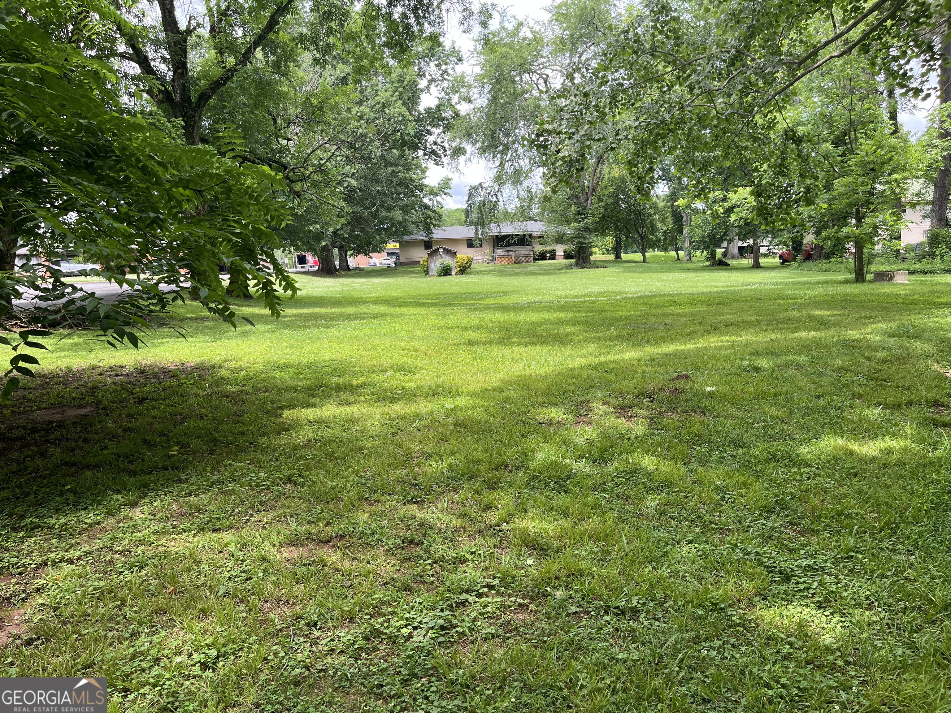 30 Highway 411 Street Southeast Cave Spring, GA 30124 - Photo 3 of 12 a view of a park with trees and flowers