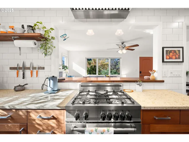 a kitchen with a stove and a sink