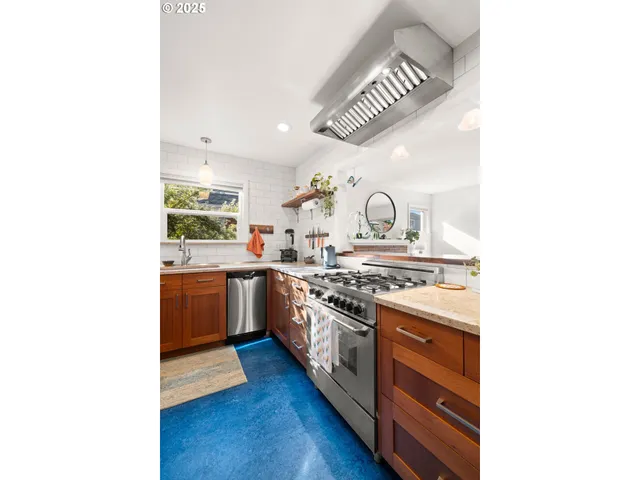 a bedroom with a bed window and a flat tv screen