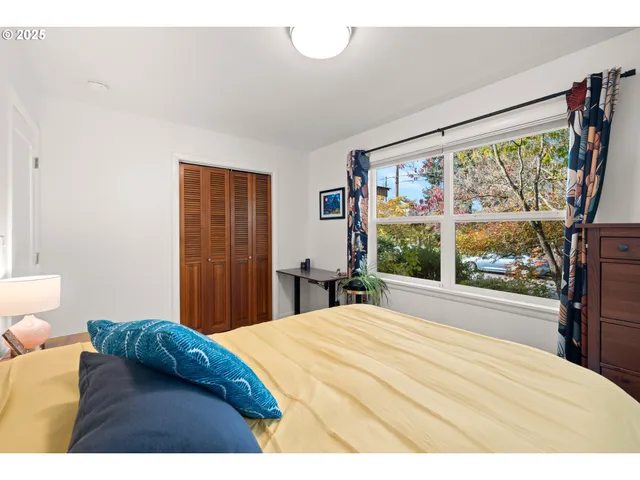 a bedroom with a bed and a bookshelf