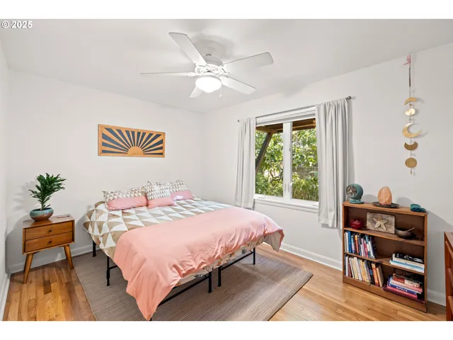 a bed room with a bed and a chandelier