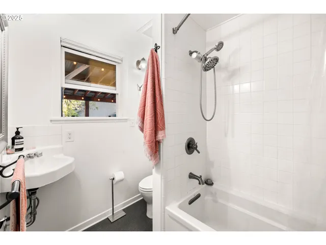 a living room with furniture rug and a large window
