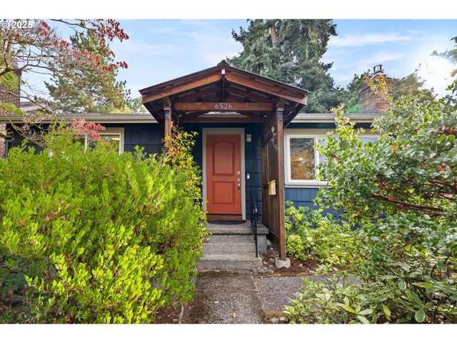 a view of a wooden door and a yard