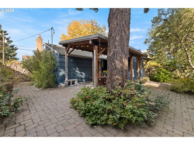 a view of a porch with a table and chairs