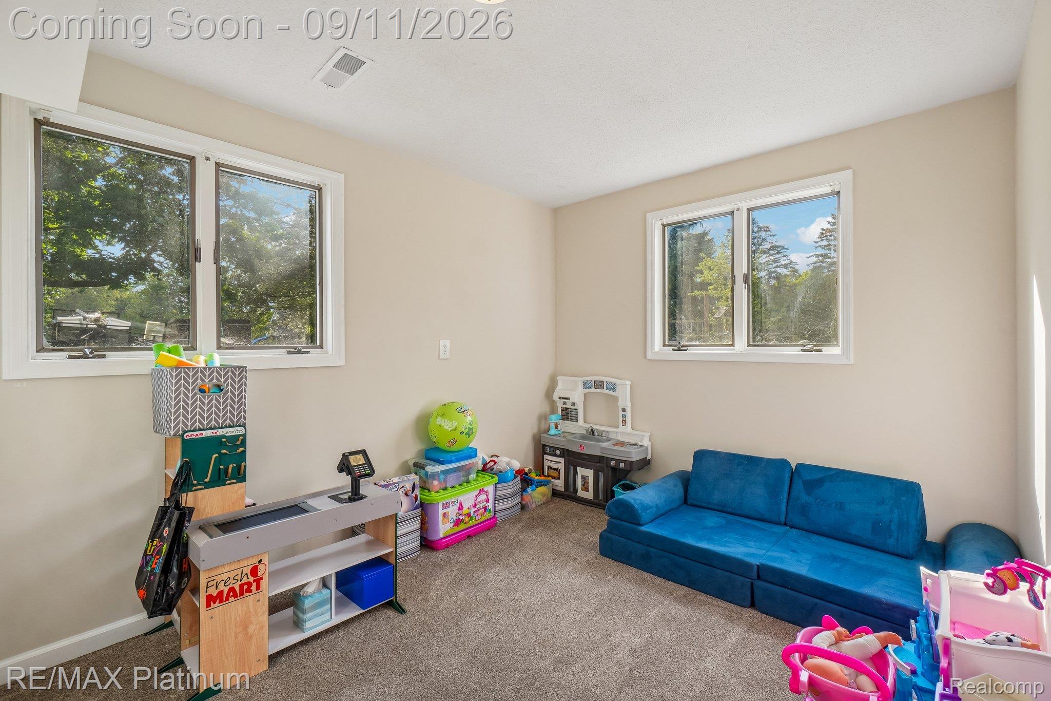 12126 Linden Road Linden, MI 48451 - Photo 17 of 38 Neutral wall paint, plush carpet flooring, recessed lighting, and white-framed windows