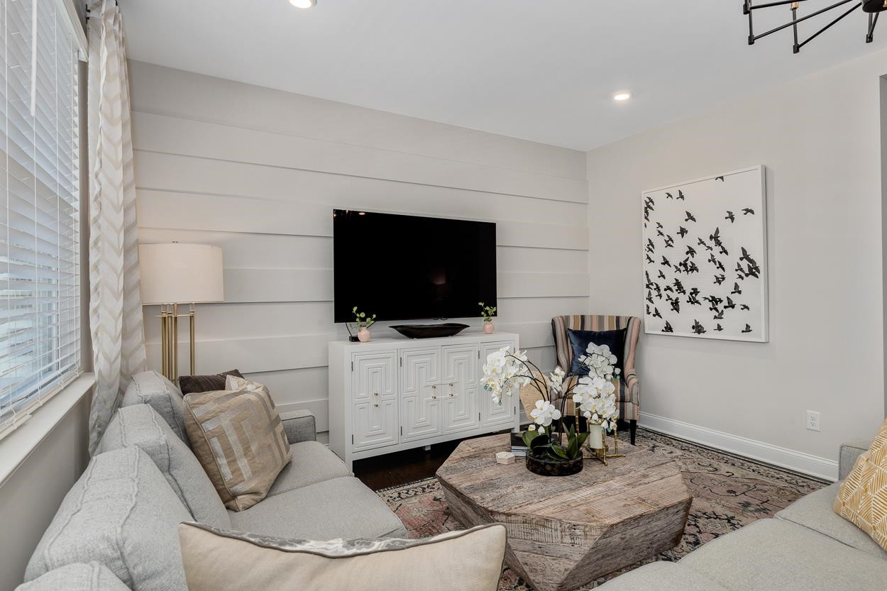 1002 Royal Mill Avenue Wake Forest, NC 27587 - Photo 16 of 51 a living room with furniture and a flat screen tv