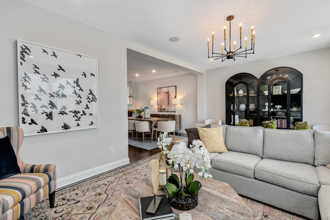 1002 Royal Mill Avenue Wake Forest, NC 27587 - Photo 17 of 51 a living room with furniture a chandelier and a chandelier