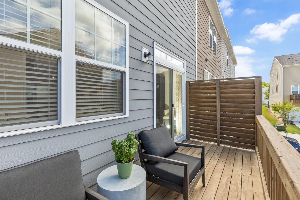 1002 Royal Mill Avenue Wake Forest, NC 27587 - Photo 19 of 51 a view of a balcony with chairs and a potted plant