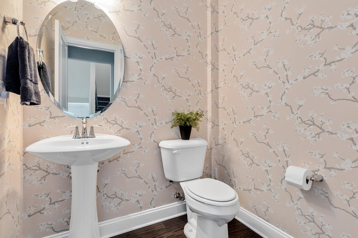 1002 Royal Mill Avenue Wake Forest, NC 27587 - Photo 20 of 51 a bathroom with a sink and mirror with toilet