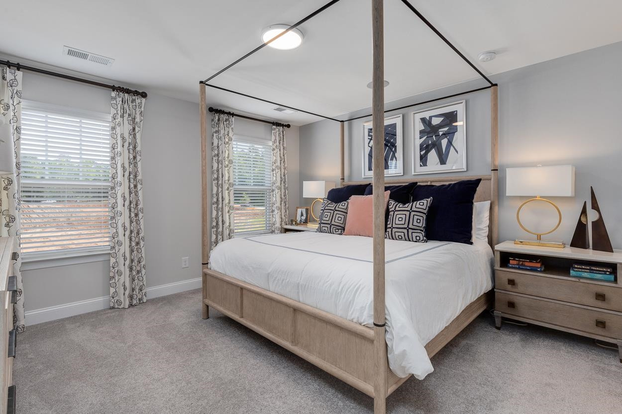 1002 Royal Mill Avenue Wake Forest, NC 27587 - Photo 21 of 51 a bed sitting in a bedroom next to a window