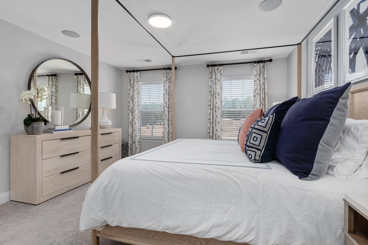 1002 Royal Mill Avenue Wake Forest, NC 27587 - Photo 23 of 51 a bedroom with a large bed and a dresser