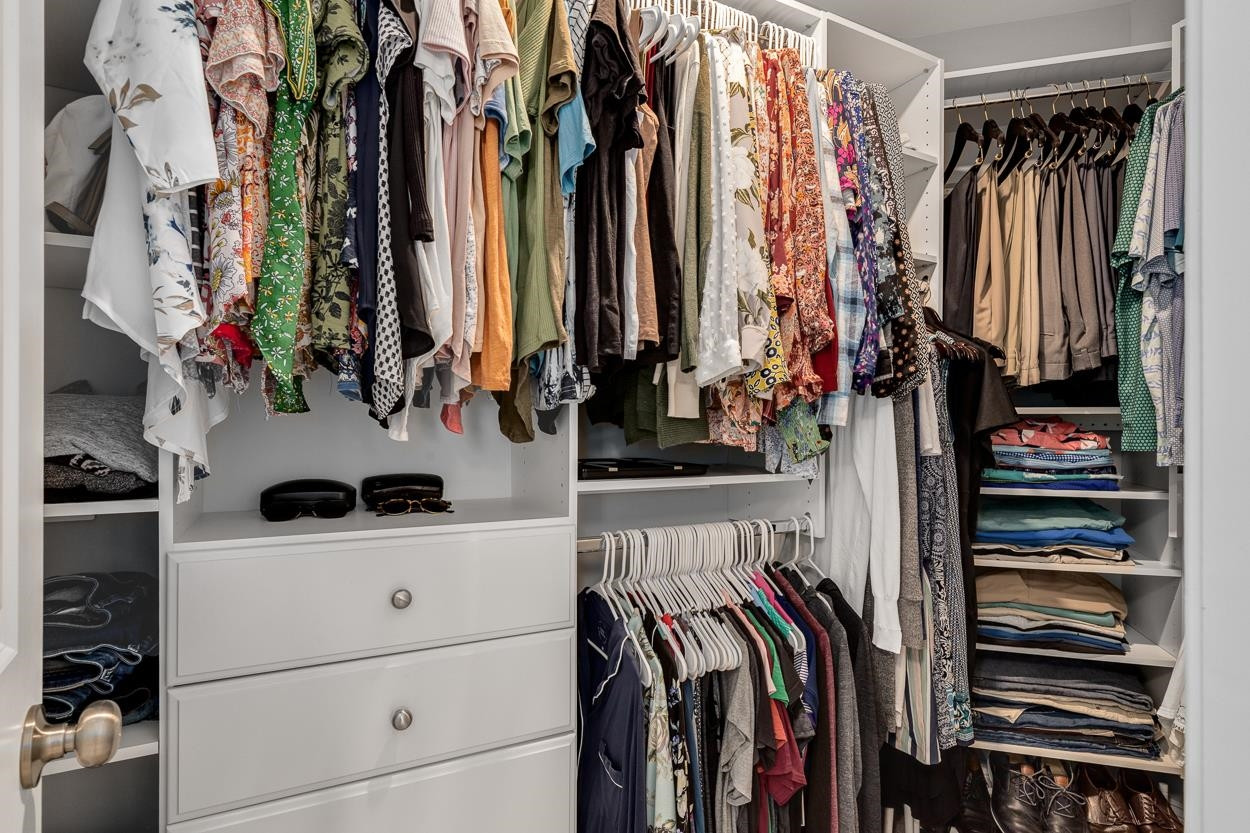 1002 Royal Mill Avenue Wake Forest, NC 27587 - Photo 26 of 51 a view of walk in closet with clothes and shoes