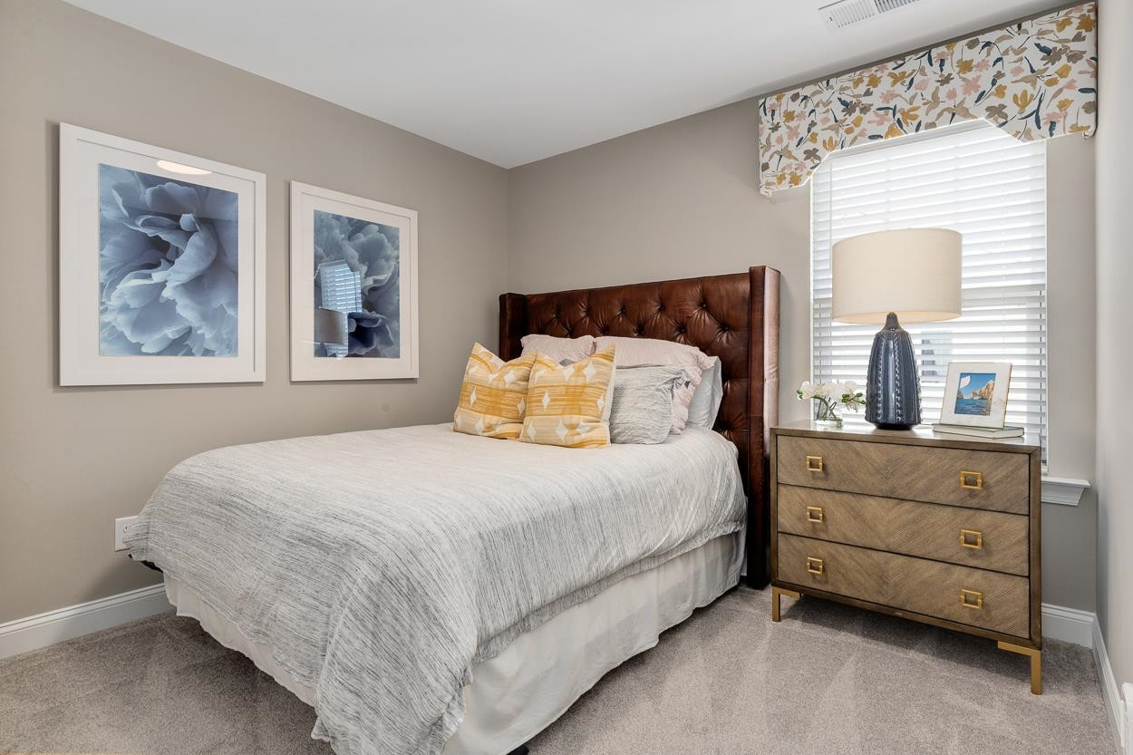1002 Royal Mill Avenue Wake Forest, NC 27587 - Photo 27 of 51 a bedroom with a bed and window
