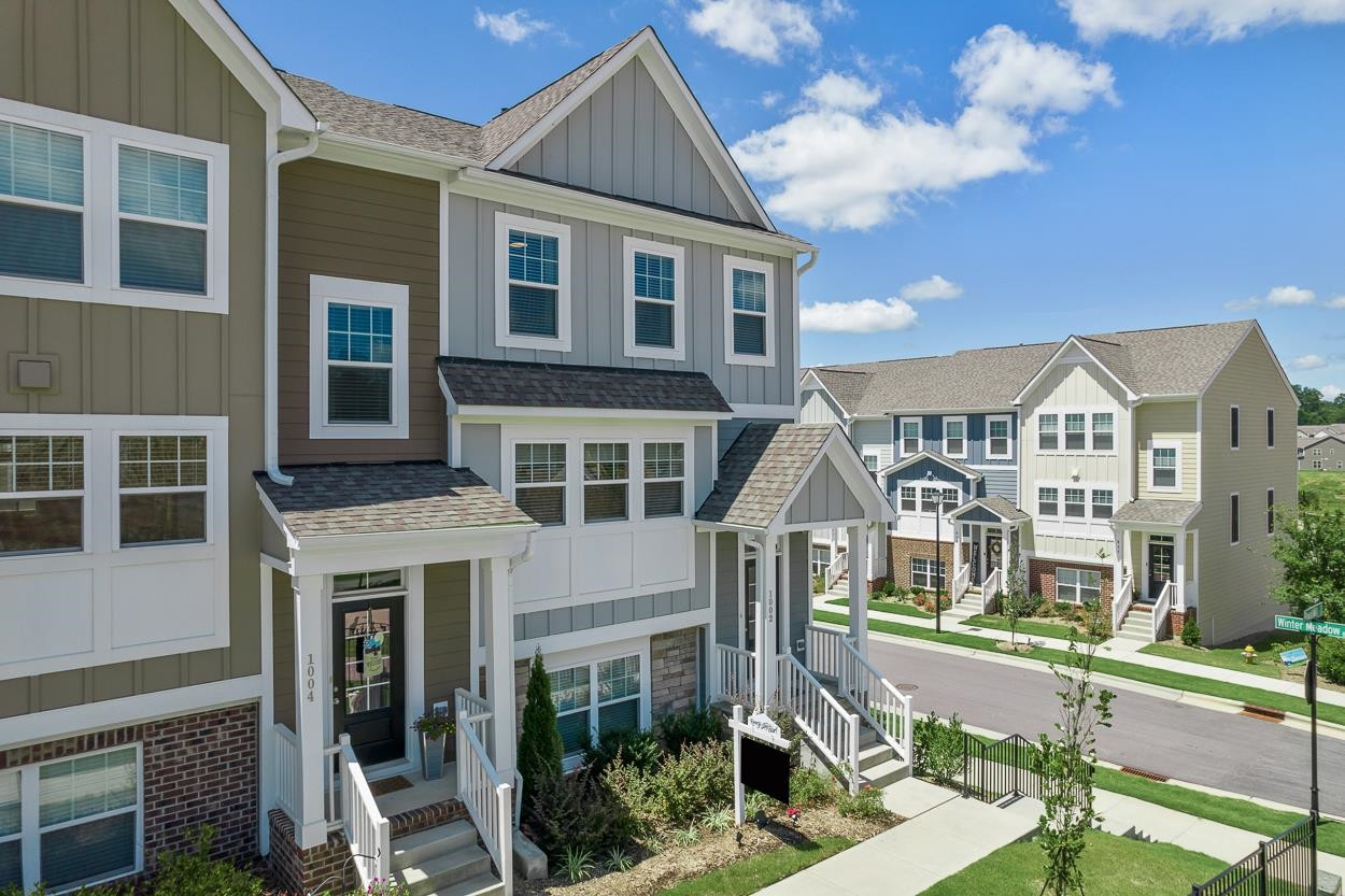 1002 Royal Mill Avenue Wake Forest, NC 27587 - Photo 3 of 51 a front view of a residential apartment building with a yard