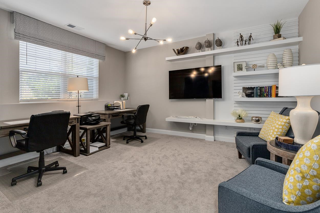1002 Royal Mill Avenue Wake Forest, NC 27587 - Photo 31 of 51 a living room with furniture and a flat screen tv